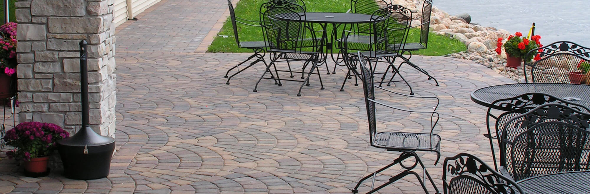 Commercial paver patio installed in an arc pattern